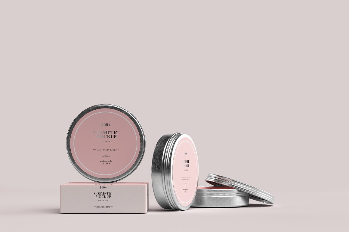 3 iron jars with a pink label on the lid and a white and pink box for a skin care product.