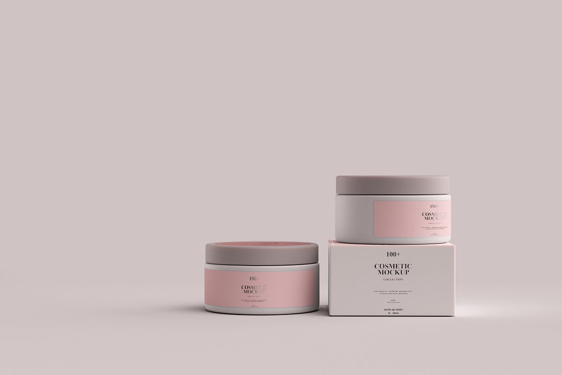 2 white jars with a pink label and lid and a white box for a skin care product.