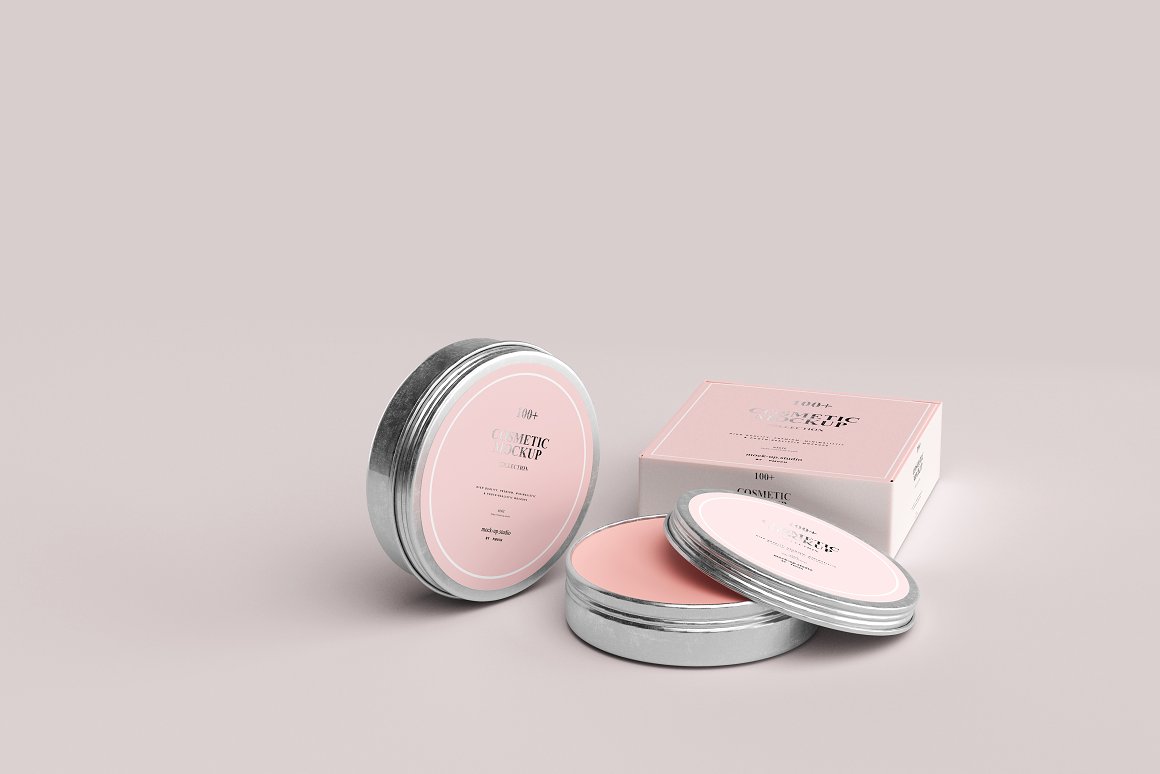 2 iron jars with a pink label on the lid and a white and pink box for a skin care product.