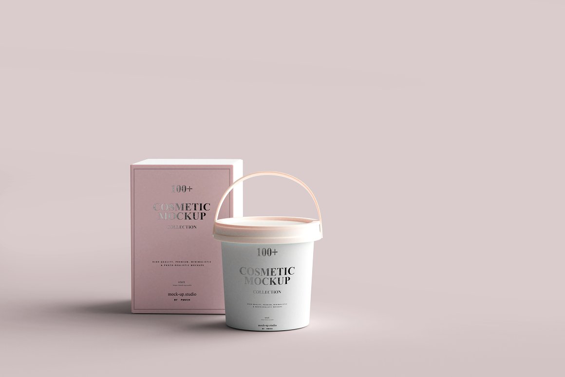 A small mint bucket with a white lid containing skincare and a pink box for it.
