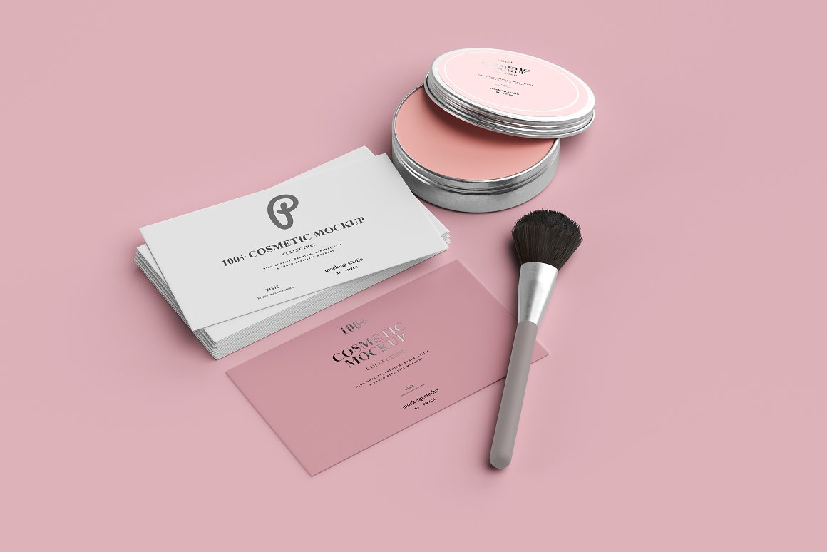 A set consisting of a brush, rouge and white and pink business cards.