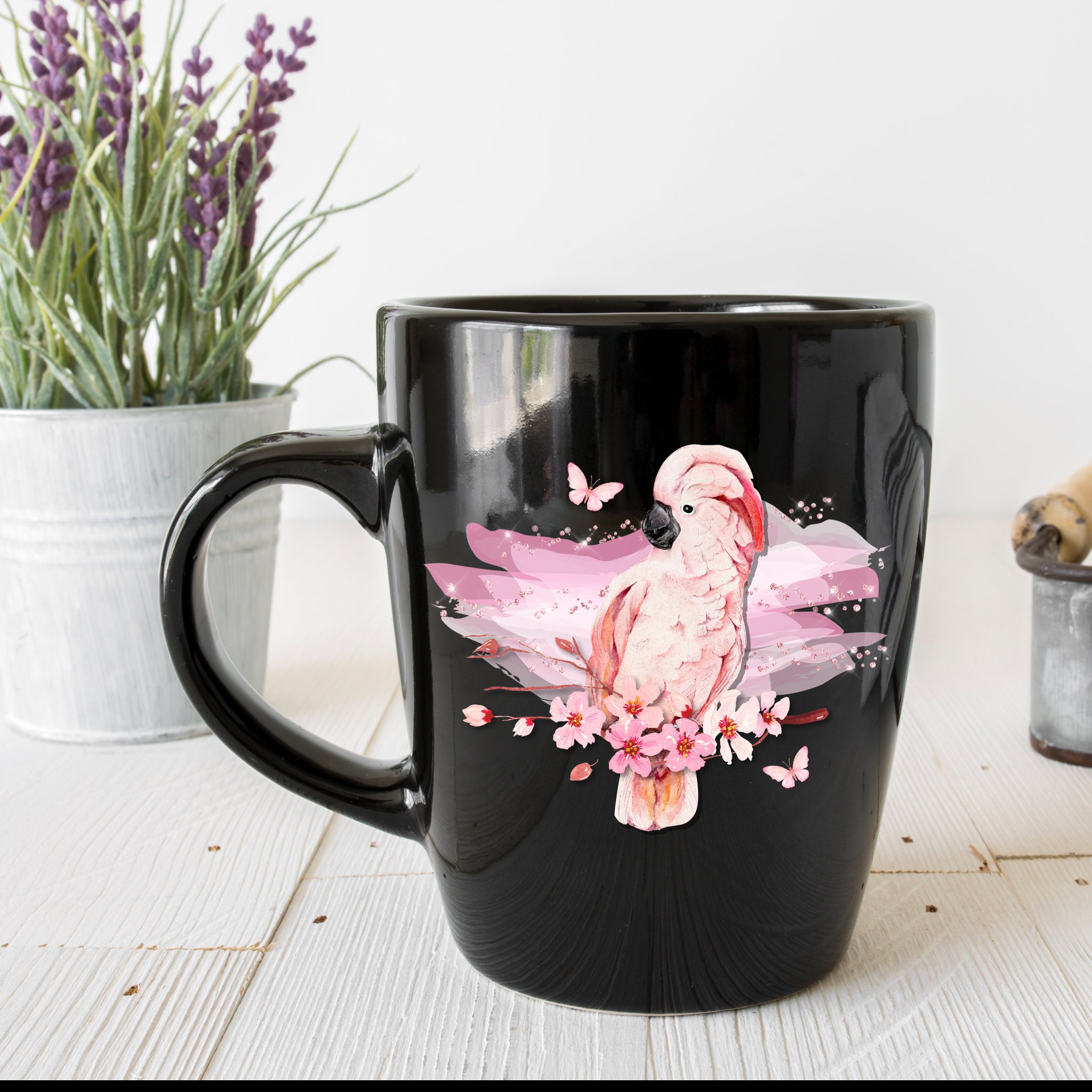Black tea cup with delicate pink cockatoo.