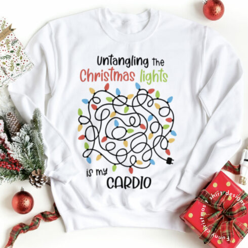 White T-shirt with a colorful print of bright Christmas lights.
