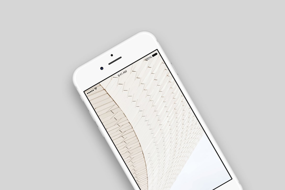 White iPhone mockup with an image on a gray background.