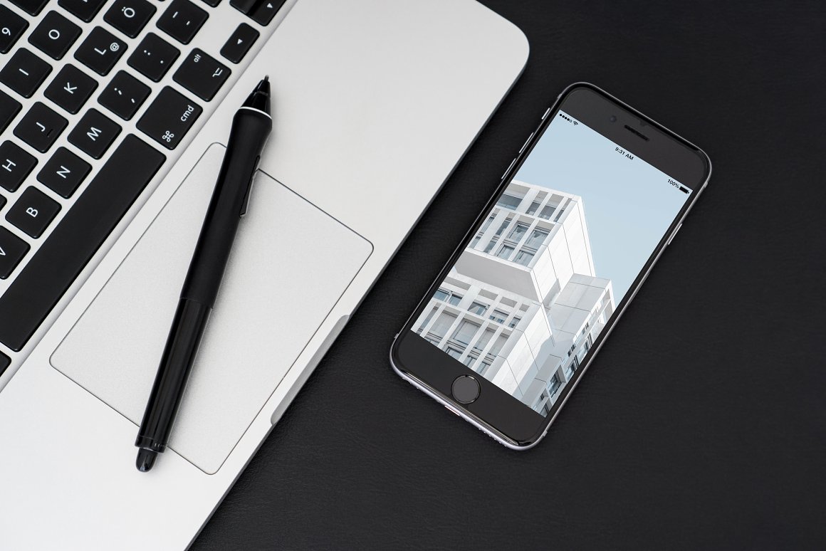 Black IPhone Mockup with an image and MacBook with black pencil.