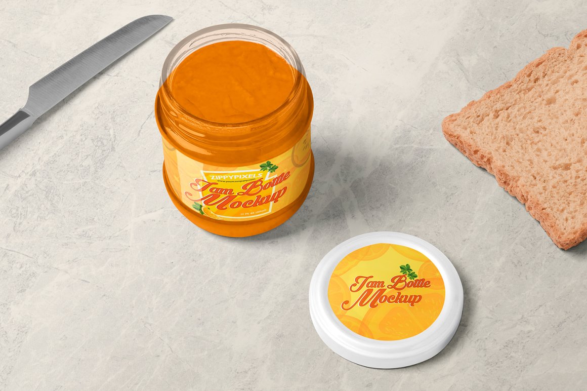 An open orange glass jam jar with a white lid and an orange label with the lettering "I'm a bottle mockup", a knife and a piece of toast bread.