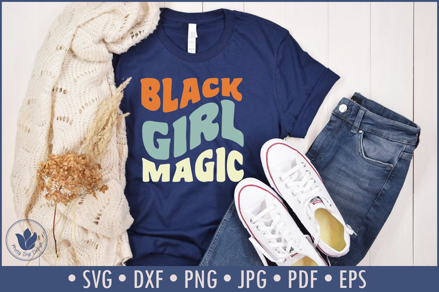 Blue T-shirt with a multi-colour print that says "Black Girl Magic".