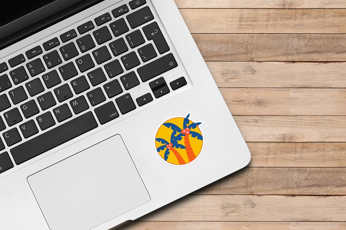 Image of laptop with colorful sticker with picture of palm trees.