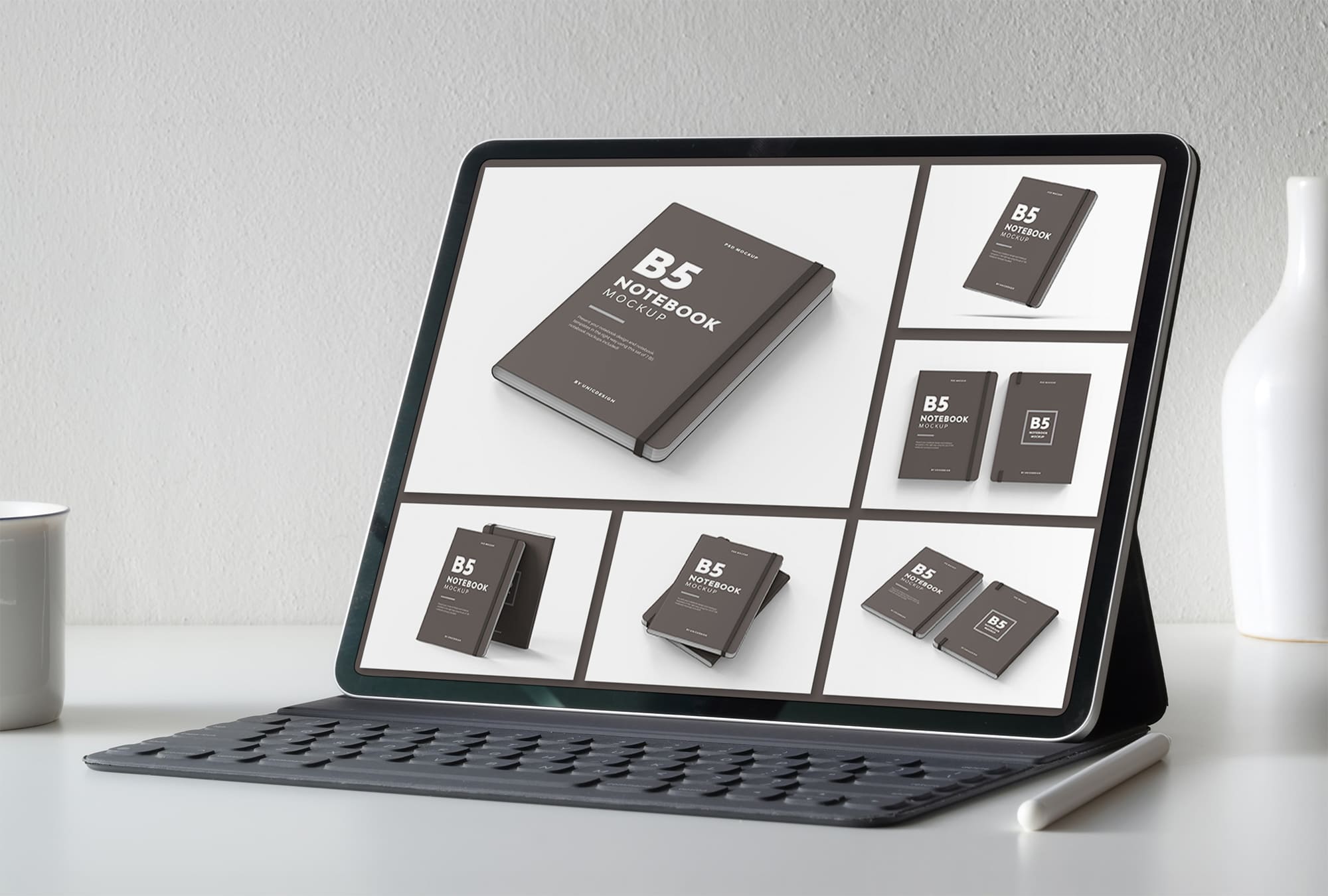 Tablet on screen with images of lovely b5 notebook mockup.