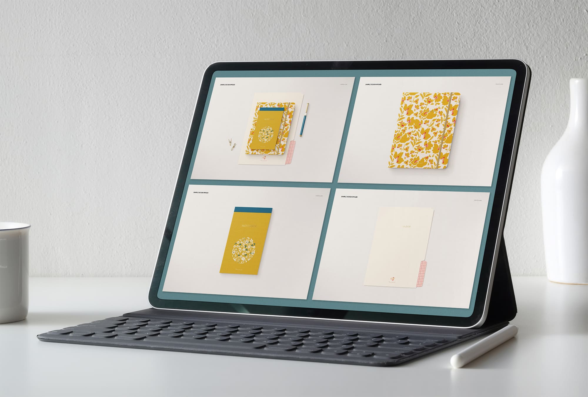 Tablet on screen with images of lovely stationery mockup.