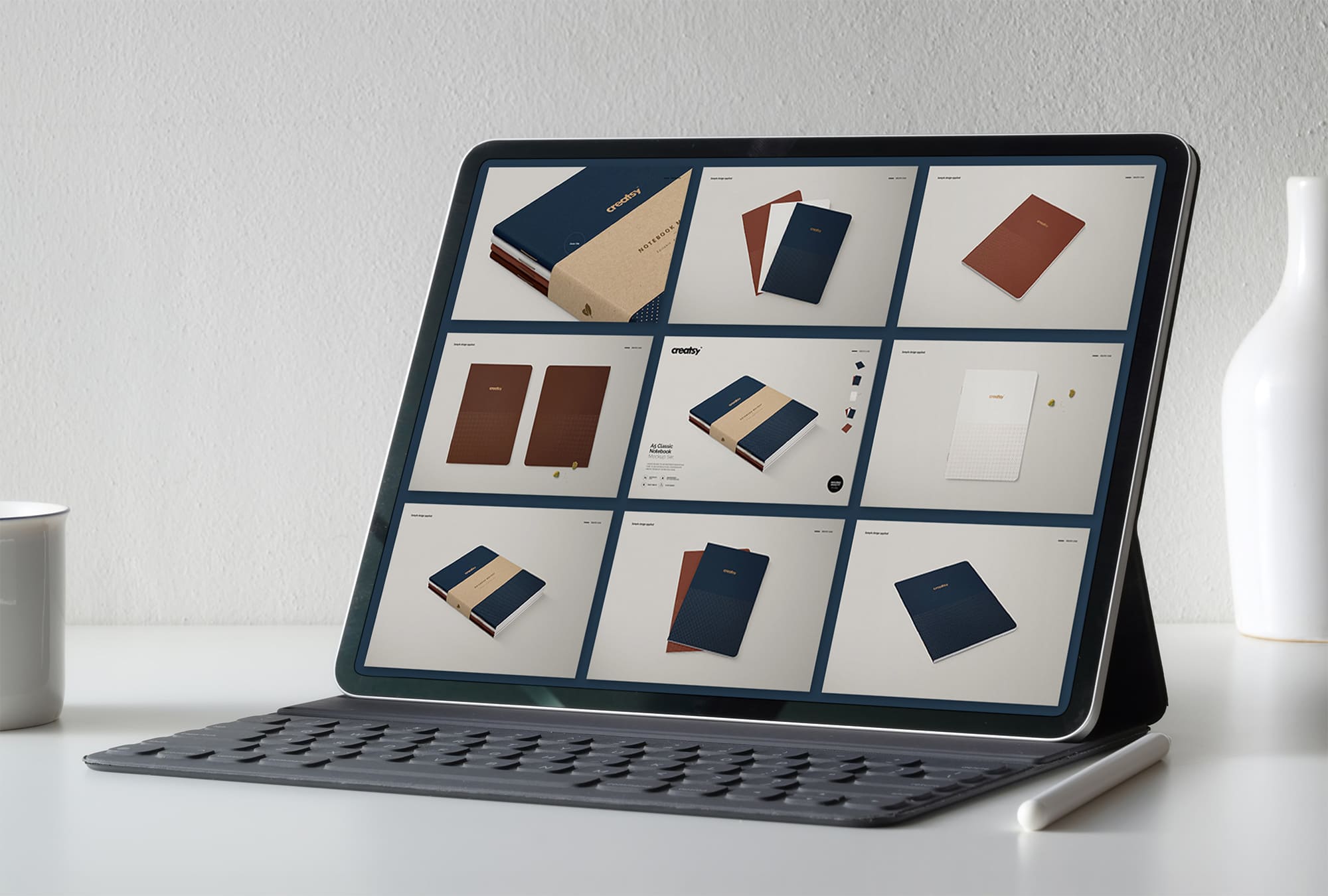 Tablet on screen with images of lovely A5 classic notebook mockup.