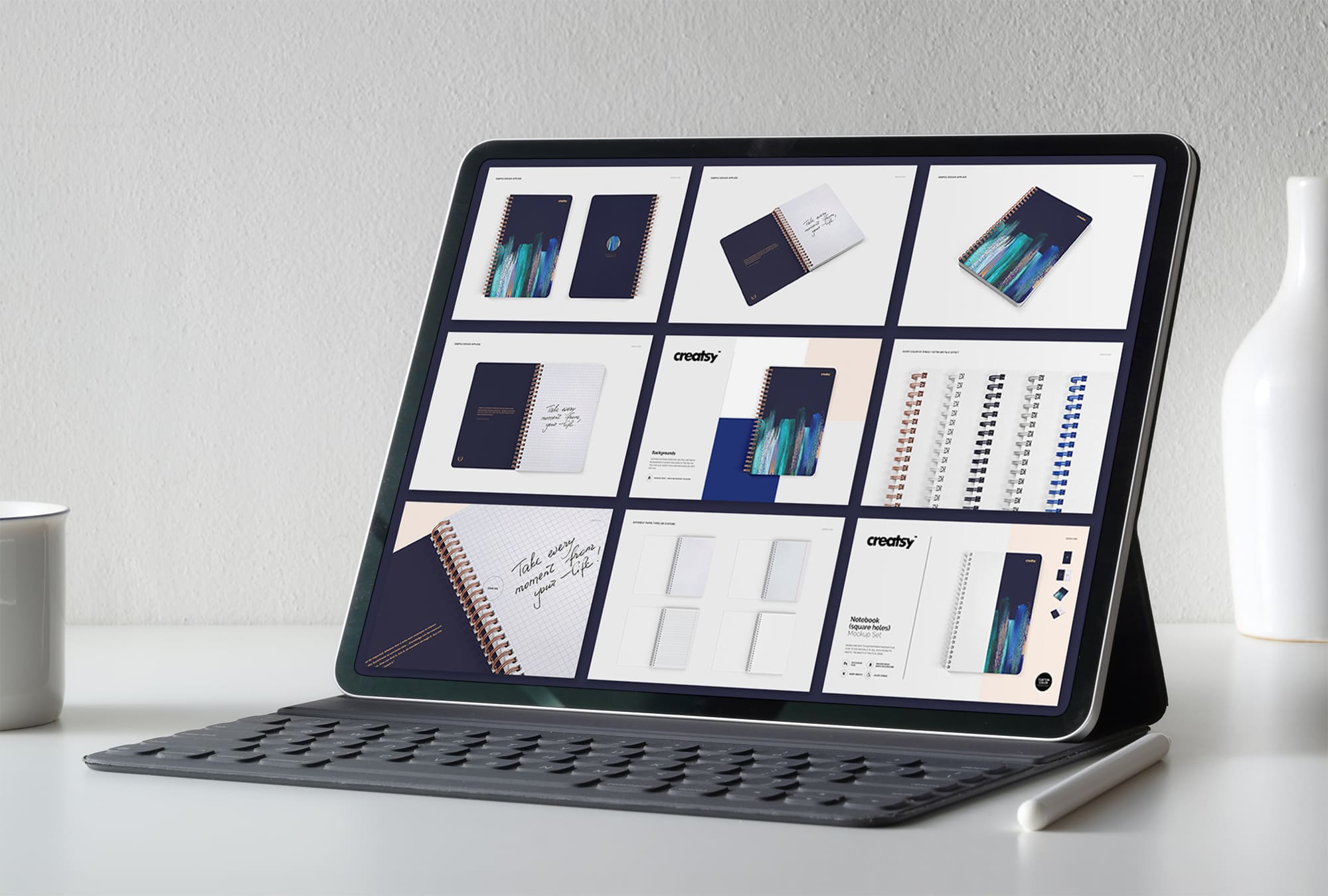Tablet on screen with images of lovely spiral notebook mockup.