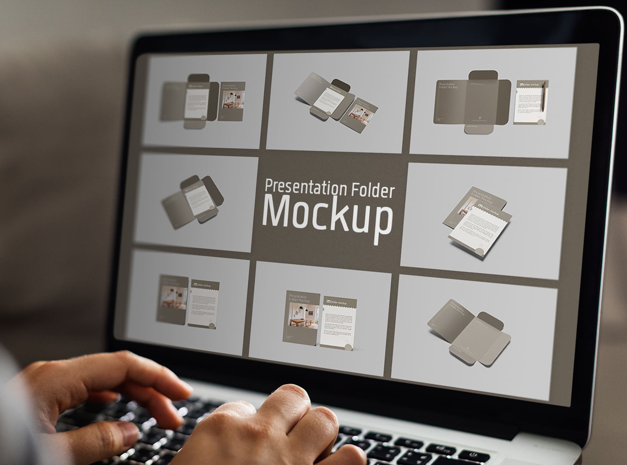 Laptop on screen with images of colorful presentation folder mockups.