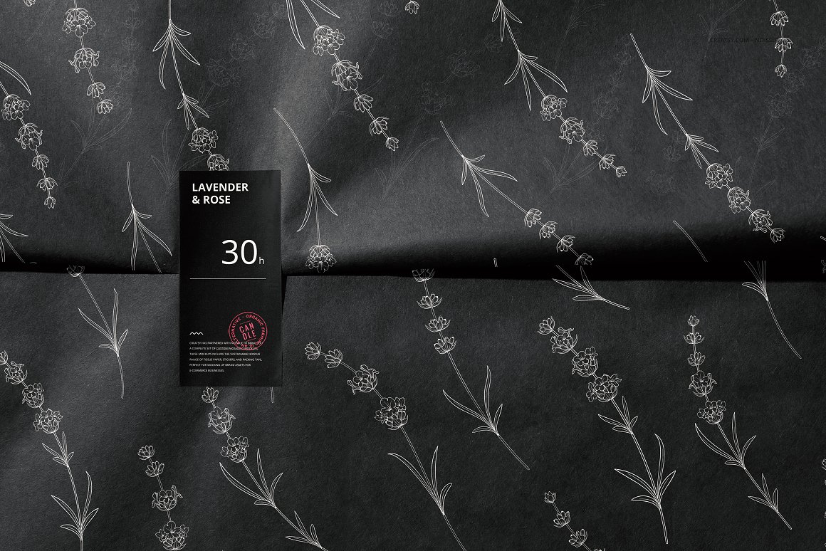 Black wrapping paper in flower print with a black label with a white lettering "Lavender & rose".