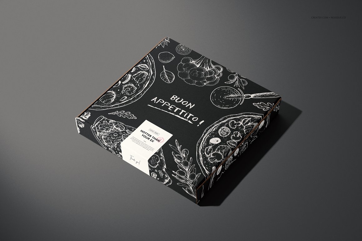 Black pizza box with a white label and the lettering "Buon Appettito!".