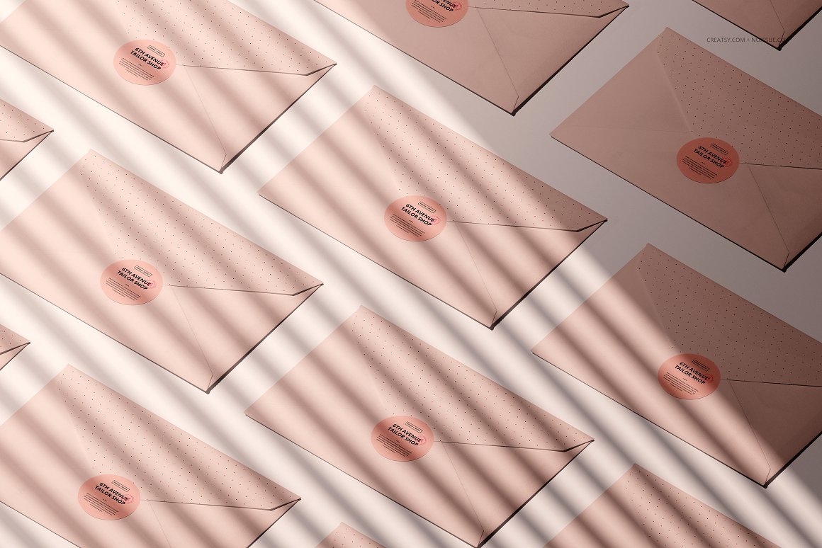 12 pink envelopes with a pink label and the lettering "6th avenue tailor shop".