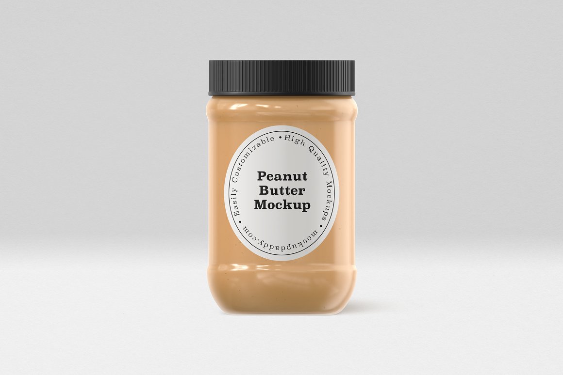 A Gold Glass Jar with a Peanut Butter, white label and black lid.