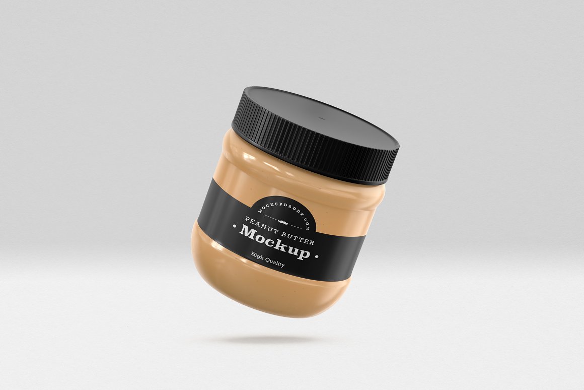 A Small Gold Glass Jar with a Peanut Butter, black label and black lid.