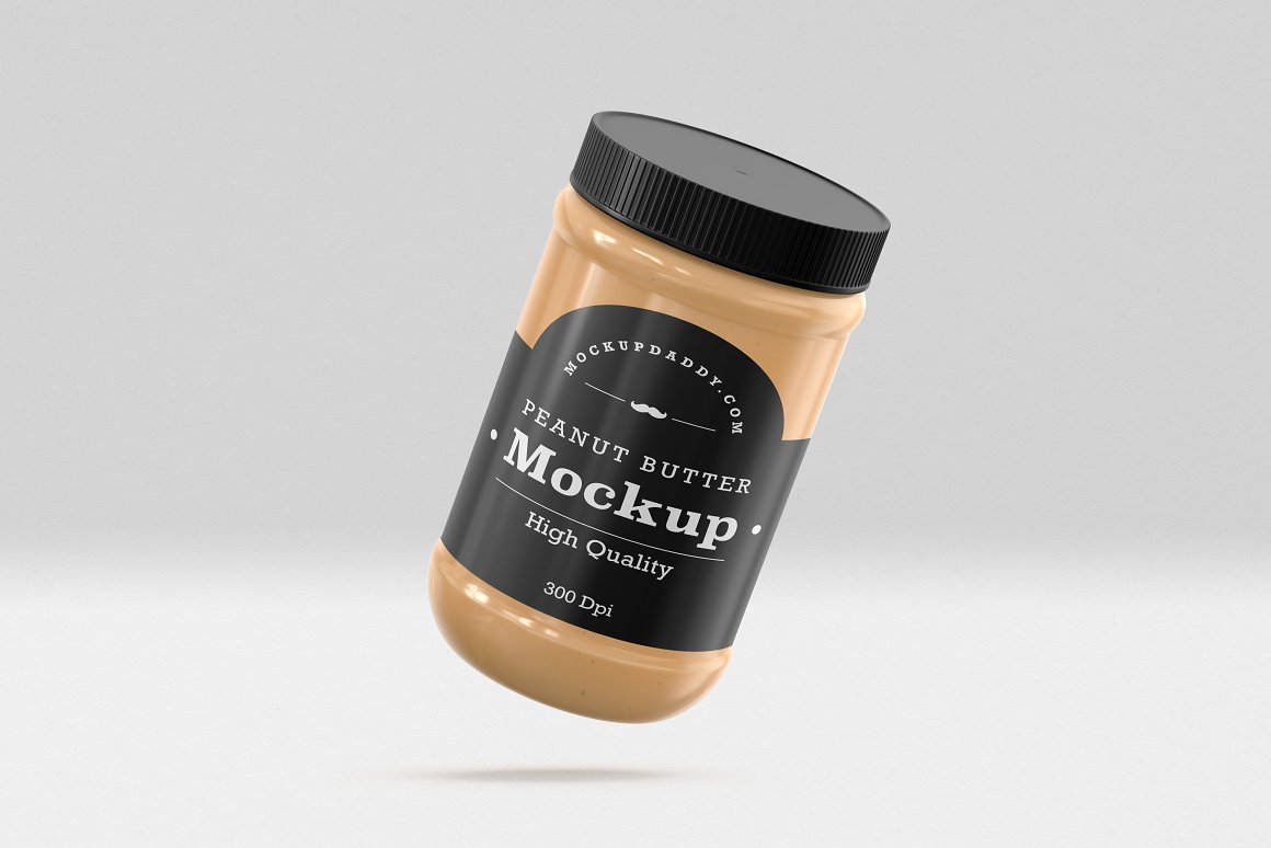 A Gold Glass Jar with a Peanut Butter, black label and black lid.