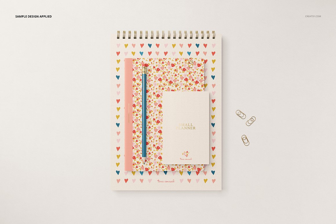 Images of stationery with patterns of hearts and flowers.