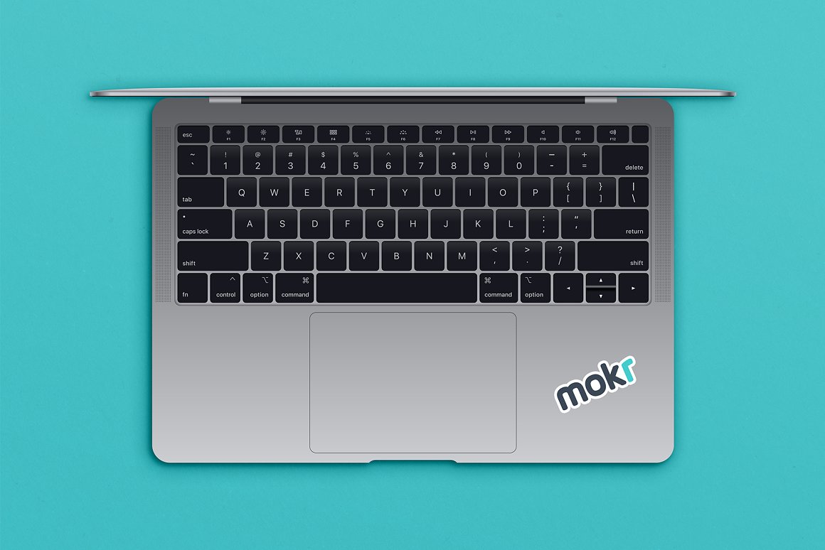 Macbook with a sticker in the form of the inscription "mokr".