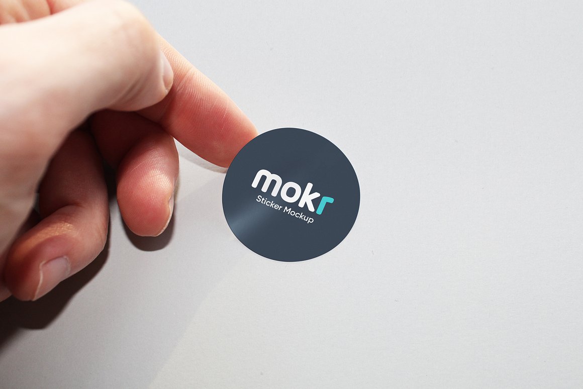 Colorful sticker mockup in round shape in black color with lettering.