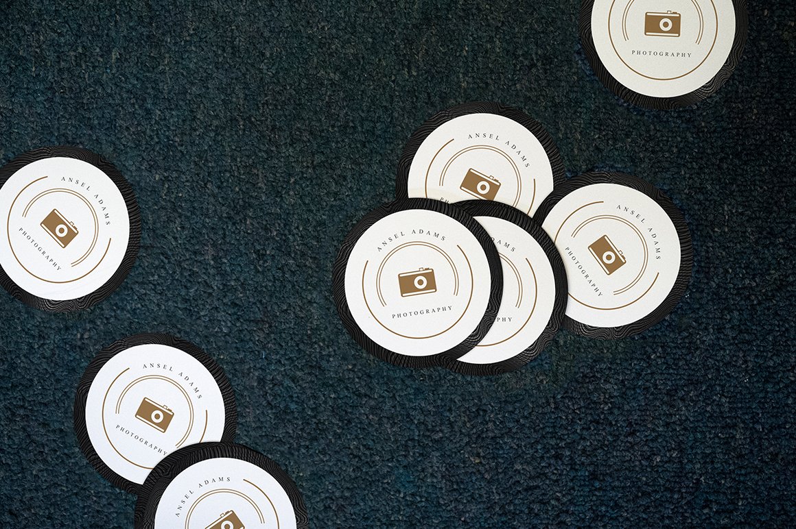 Image of exquisite round stickers with photographer's business card.