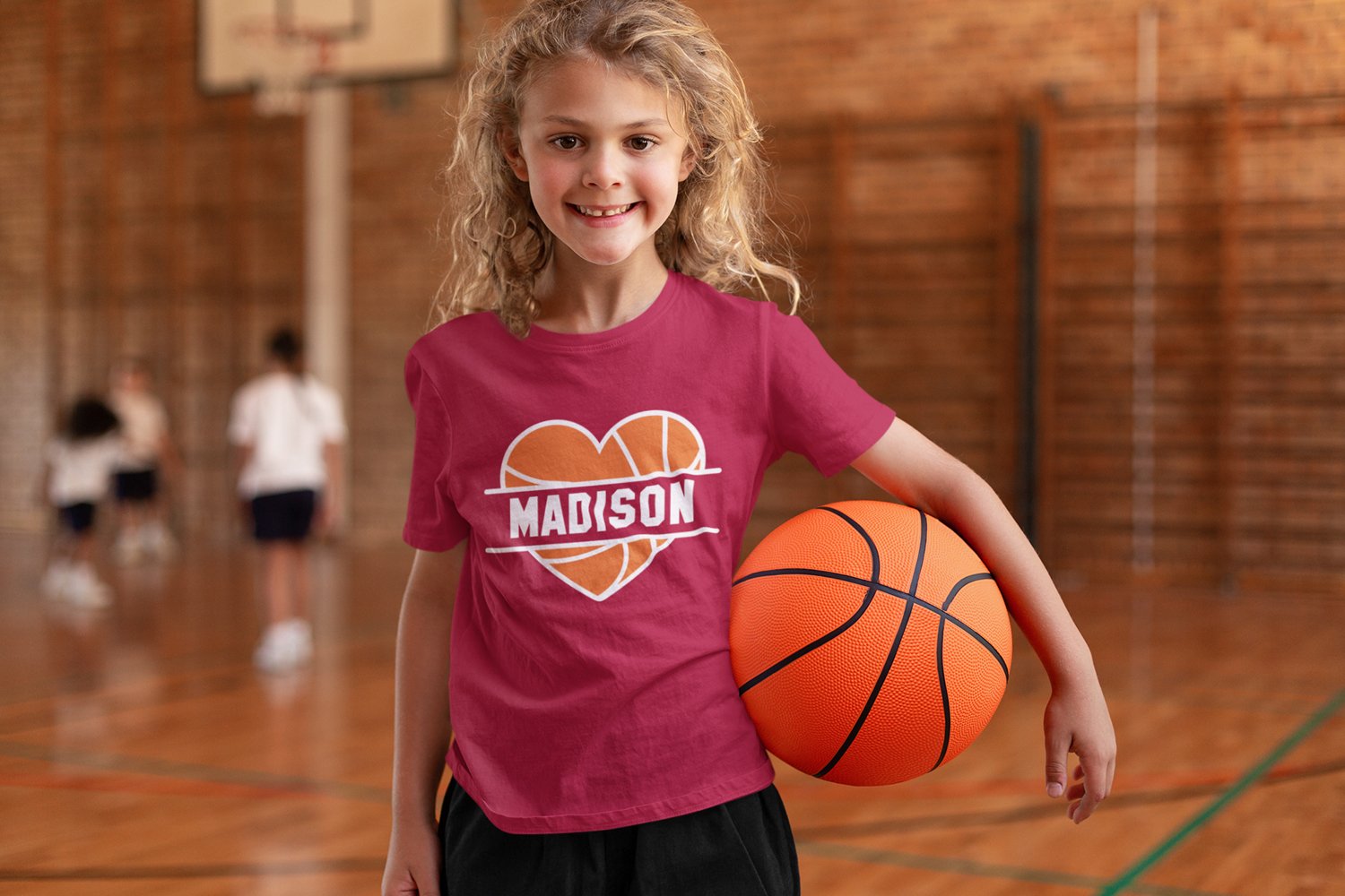 T-shirt mockup of a happy girl at basketball practice.