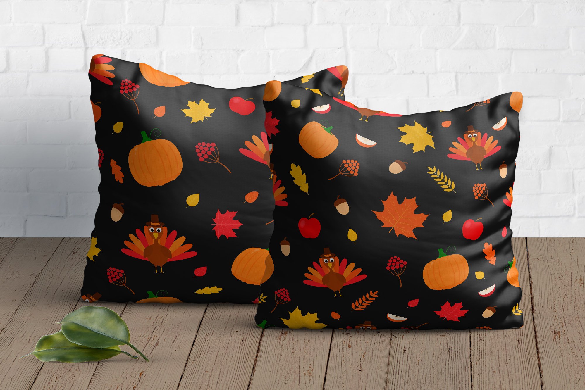 Two decorate dark pillow with Thanksgiving illustration.