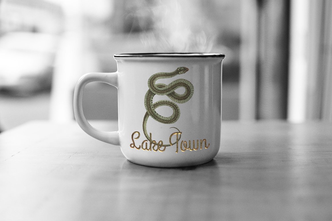 White mug with a colorful image of a poisonous viper.
