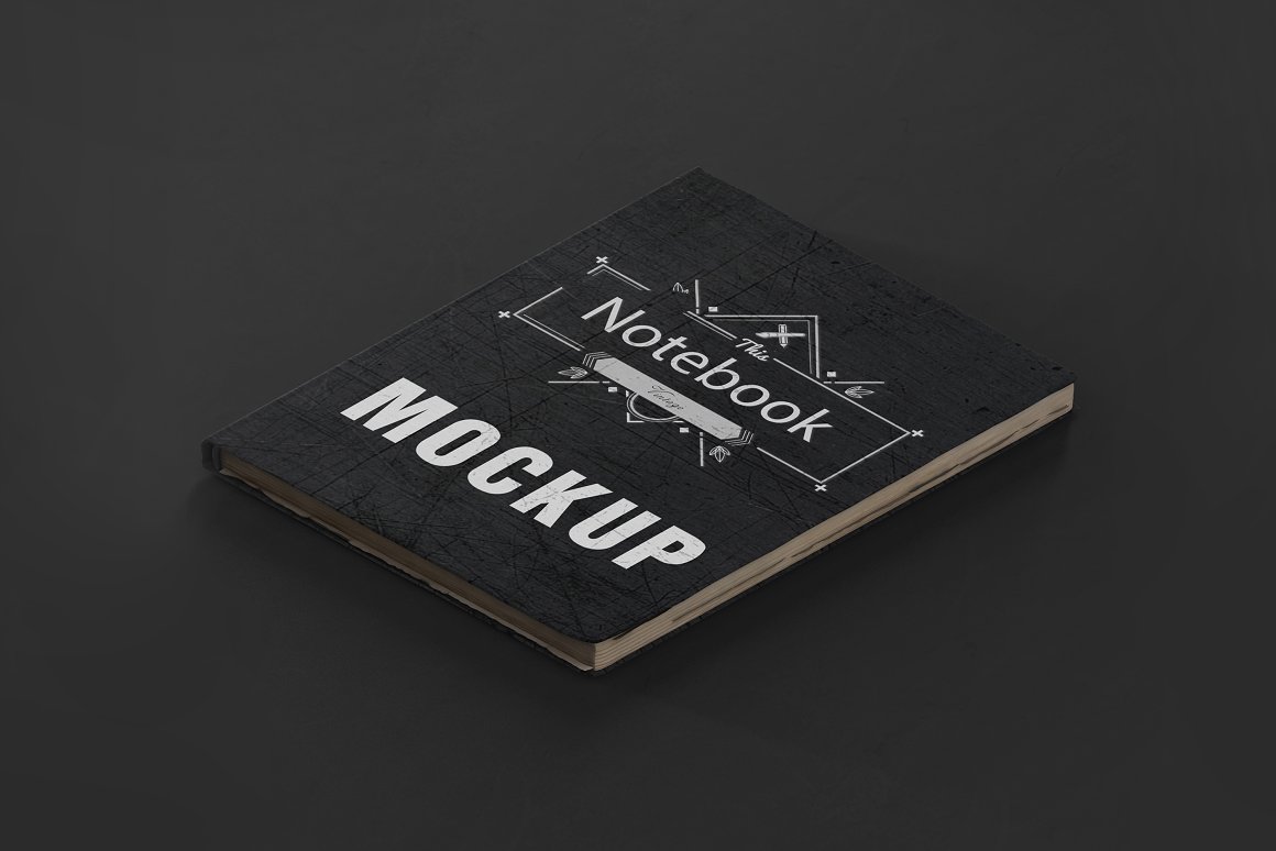 A black vintage mockup notebook with white lettering "MOCKUP".