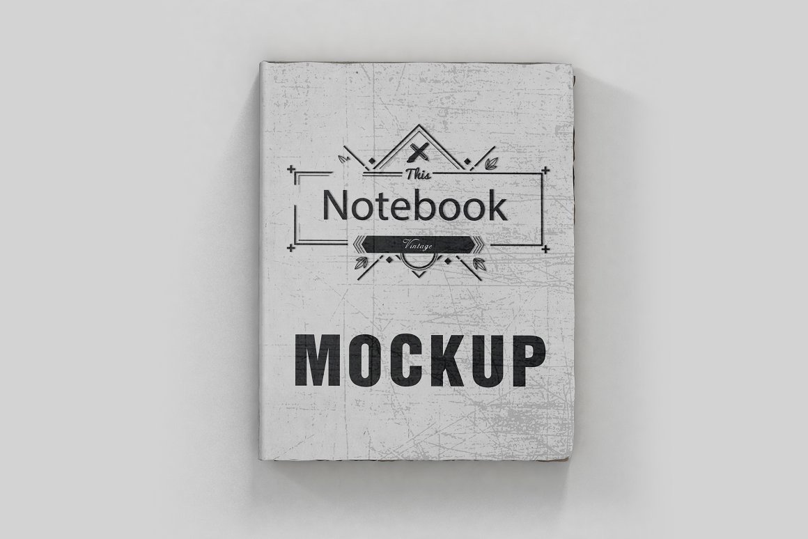 Mockup of a gray vintage notebook on a gray background.