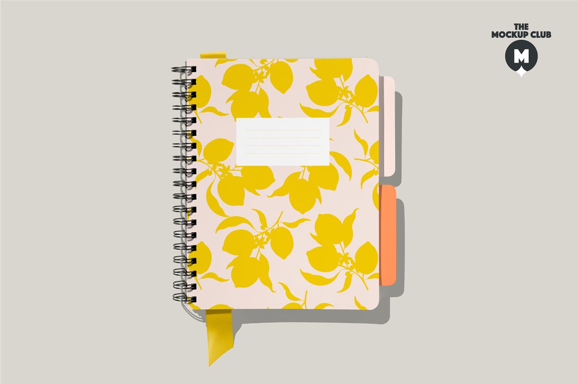 Pink spiral A4 notebook mockup with lemon images on gray background.