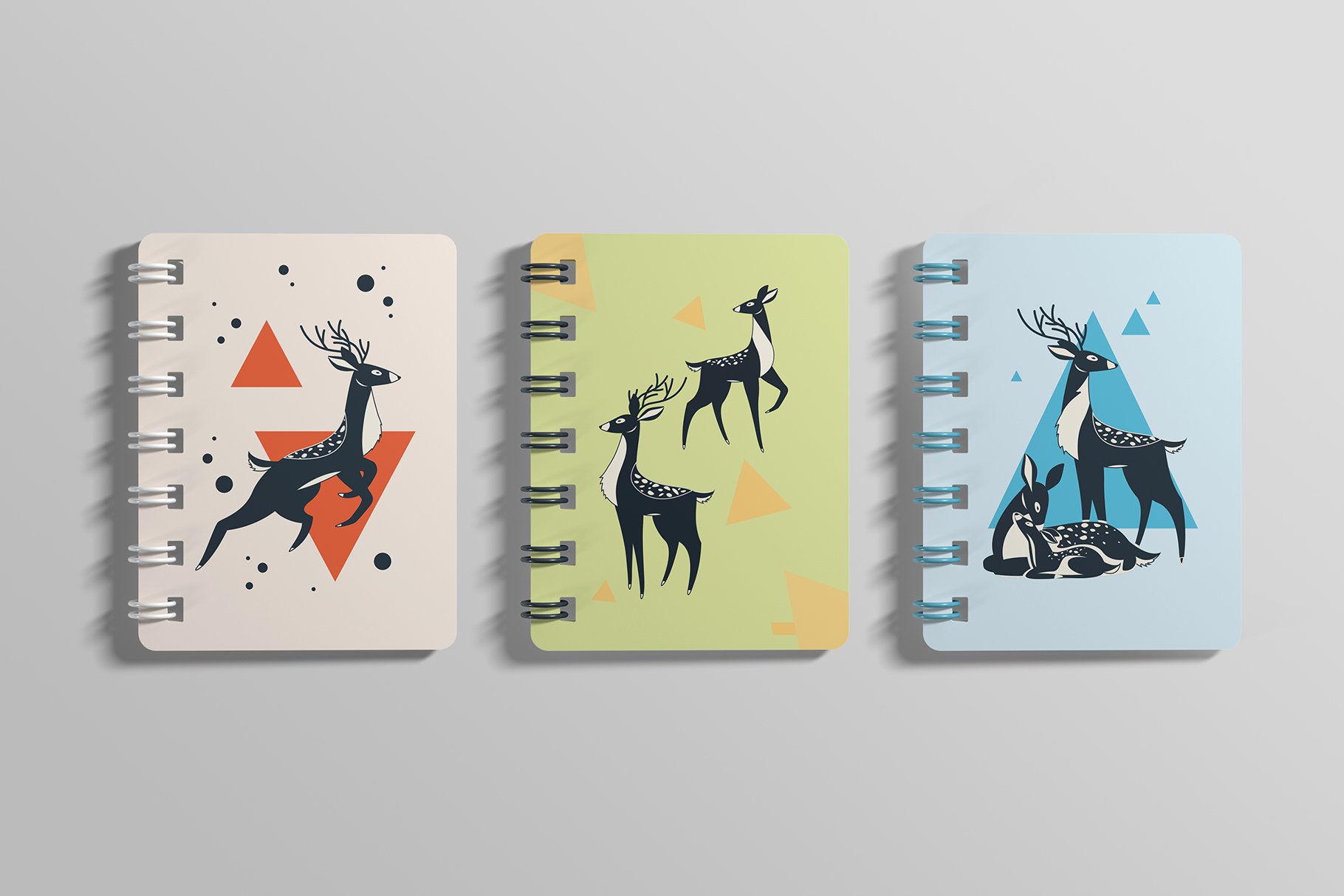 Three pastel notebooks with some some graphics.