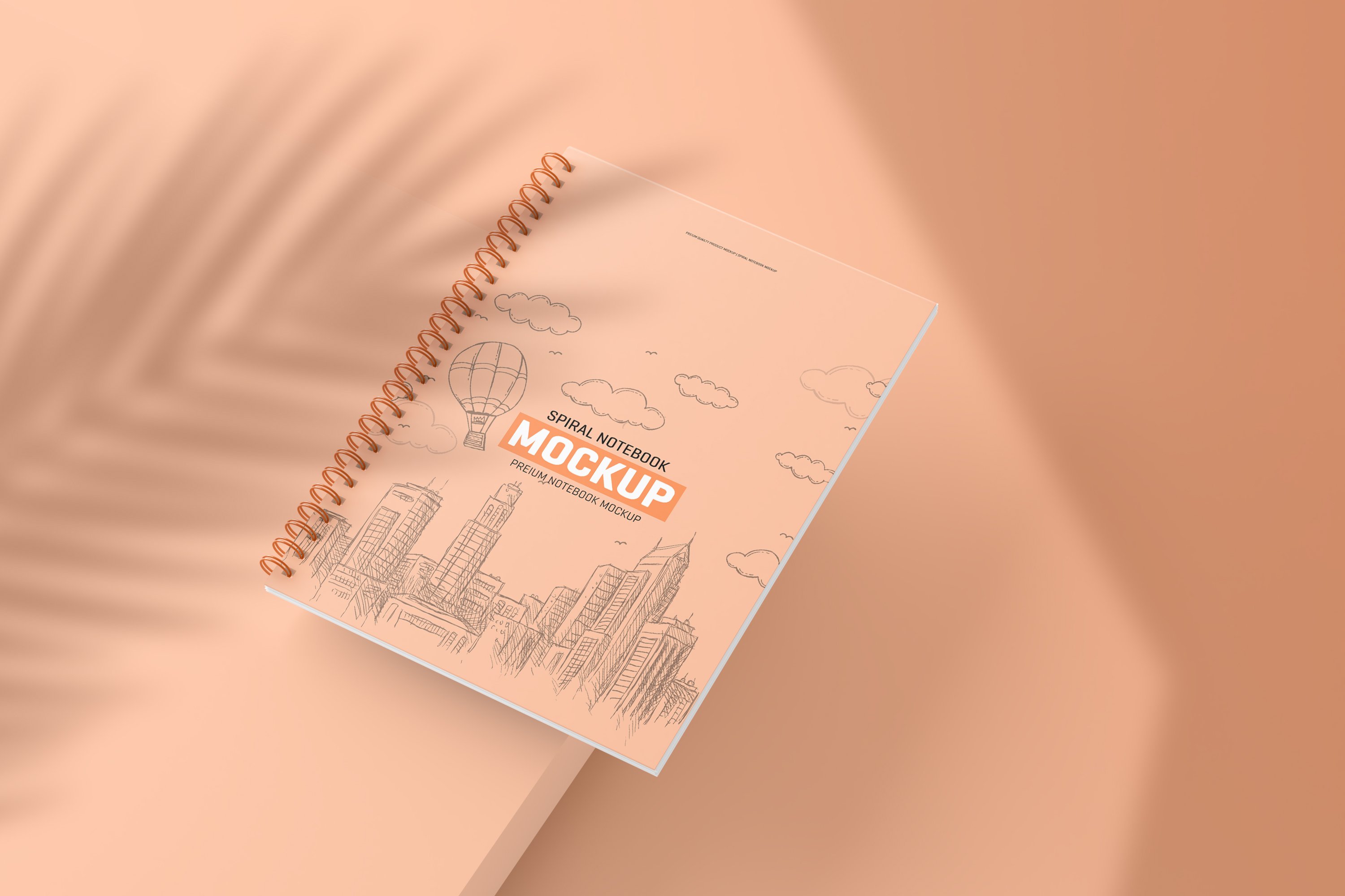 Pastel illustration with the peach notebook with the city view.