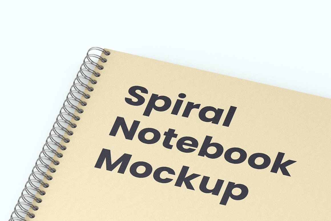 Mockup of a beige notebook with a silver spiral on a white background.