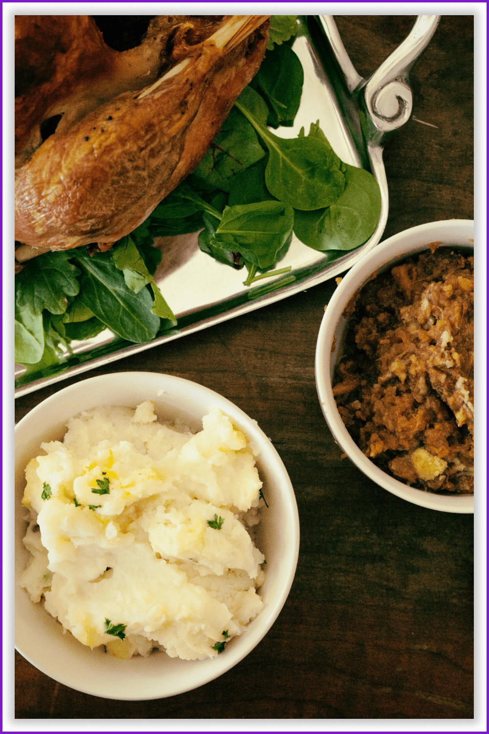 Mashed potatoes, porridge and roasted turkey on a tray.