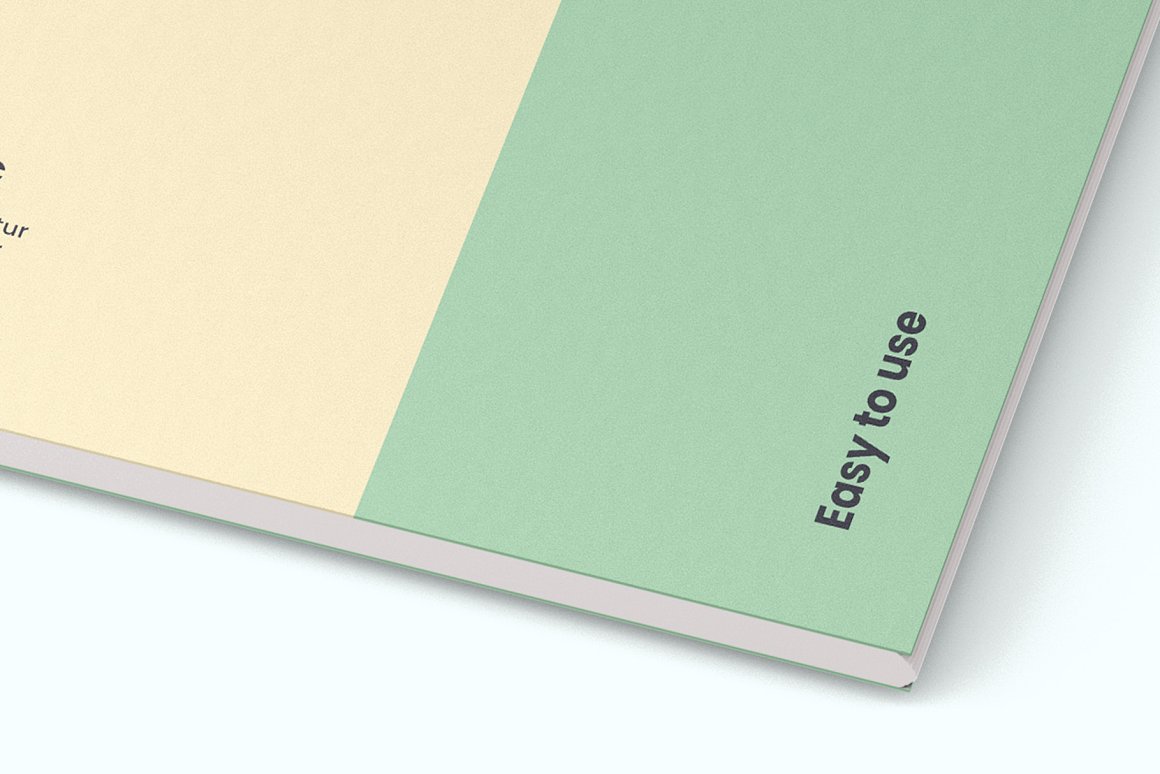 Mockup details of beige and green spiral notebook on a white background.