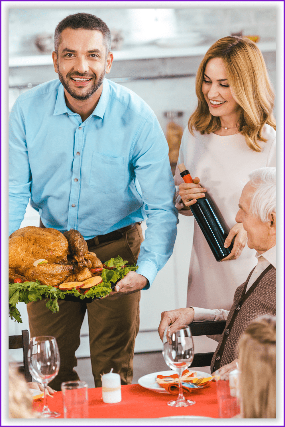 A man holds a tray with a ready-made turkey, his wife is next to him with a bottle of wine in her hands.