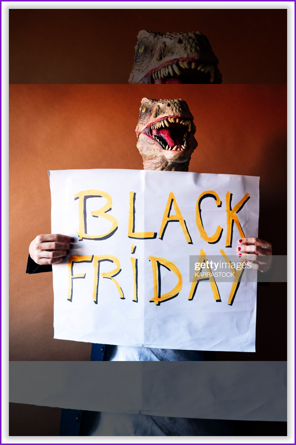 Man in lizard mask with sign Black friday in his hands.