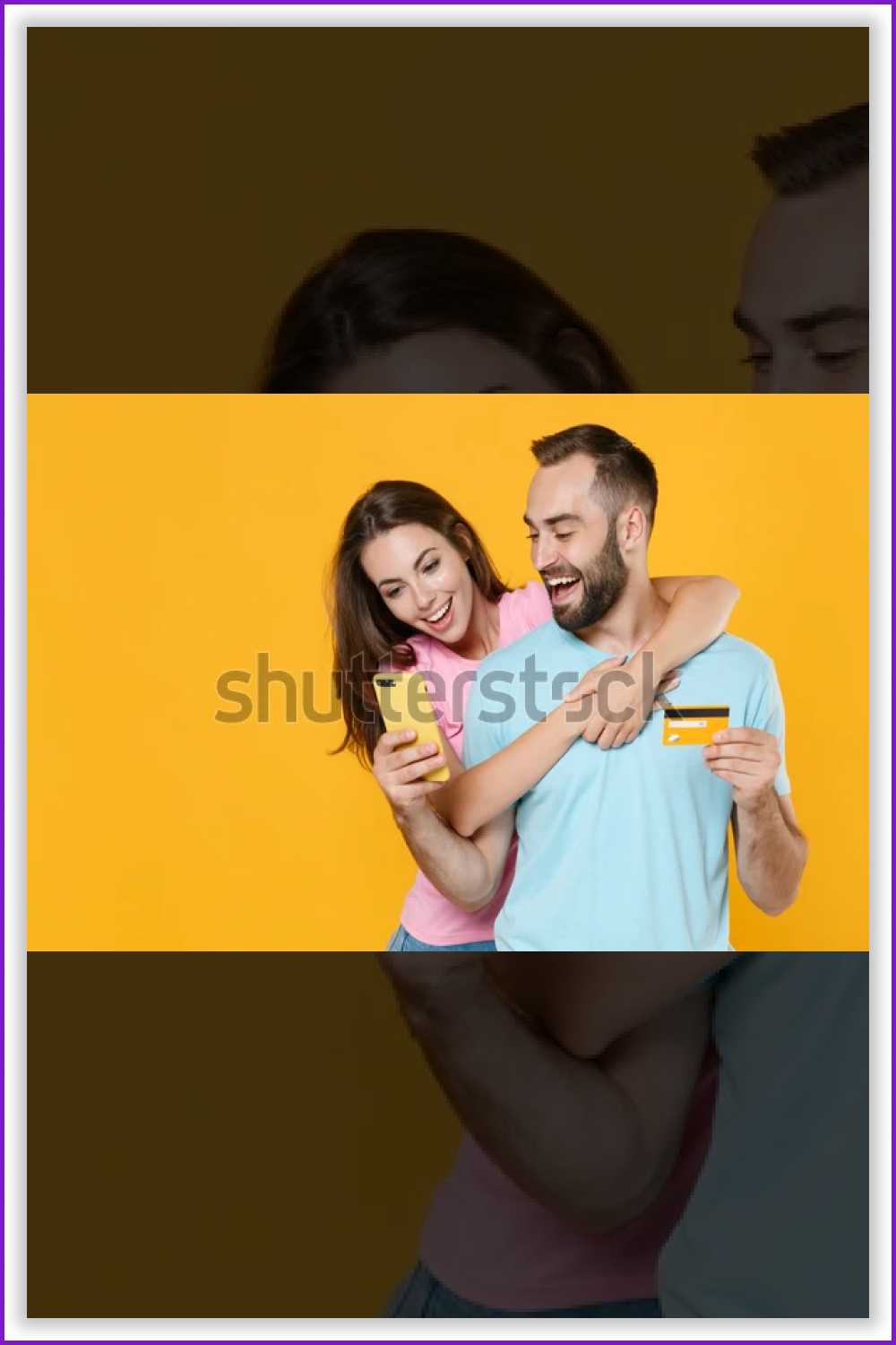 A young smiling couple with a credit card and smartphone on the yellow background.