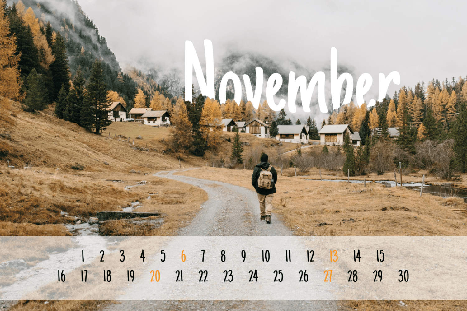 Calendar for november with photo of tourist walking through mountain village in autumn.