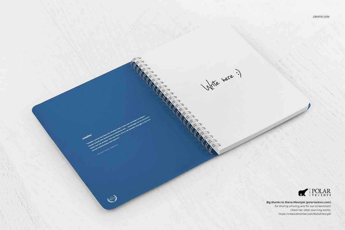 Blue notebook in open view with black lettering "Write here :)" on a white background.