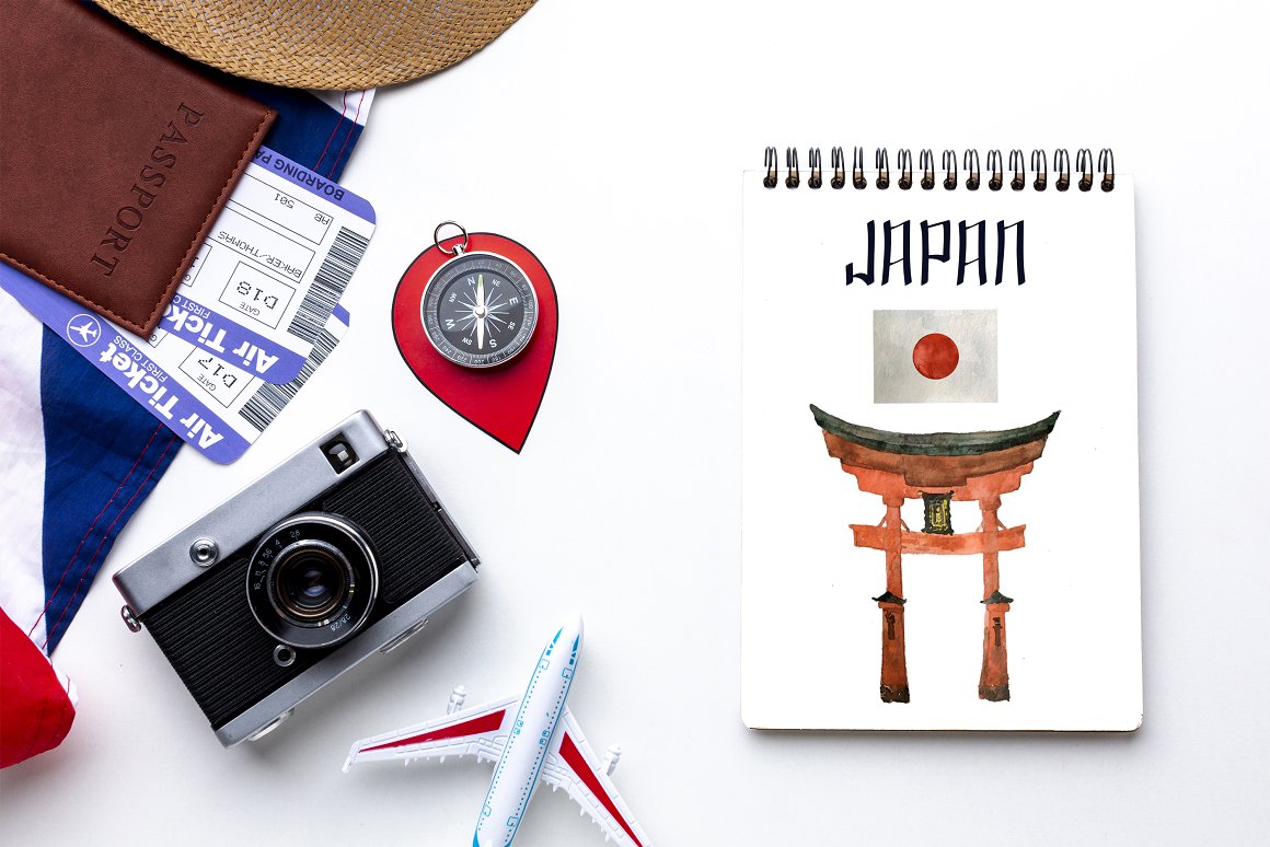 A white notebook with a black spiral and images of the sacred Japanese torii gate and the flag of Japan on a white background.