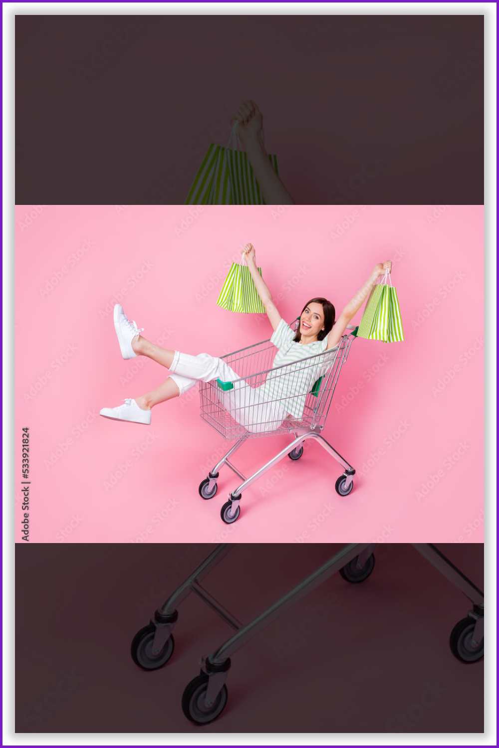 Happy woman with green paper bags in the shopping cart on the pink background.