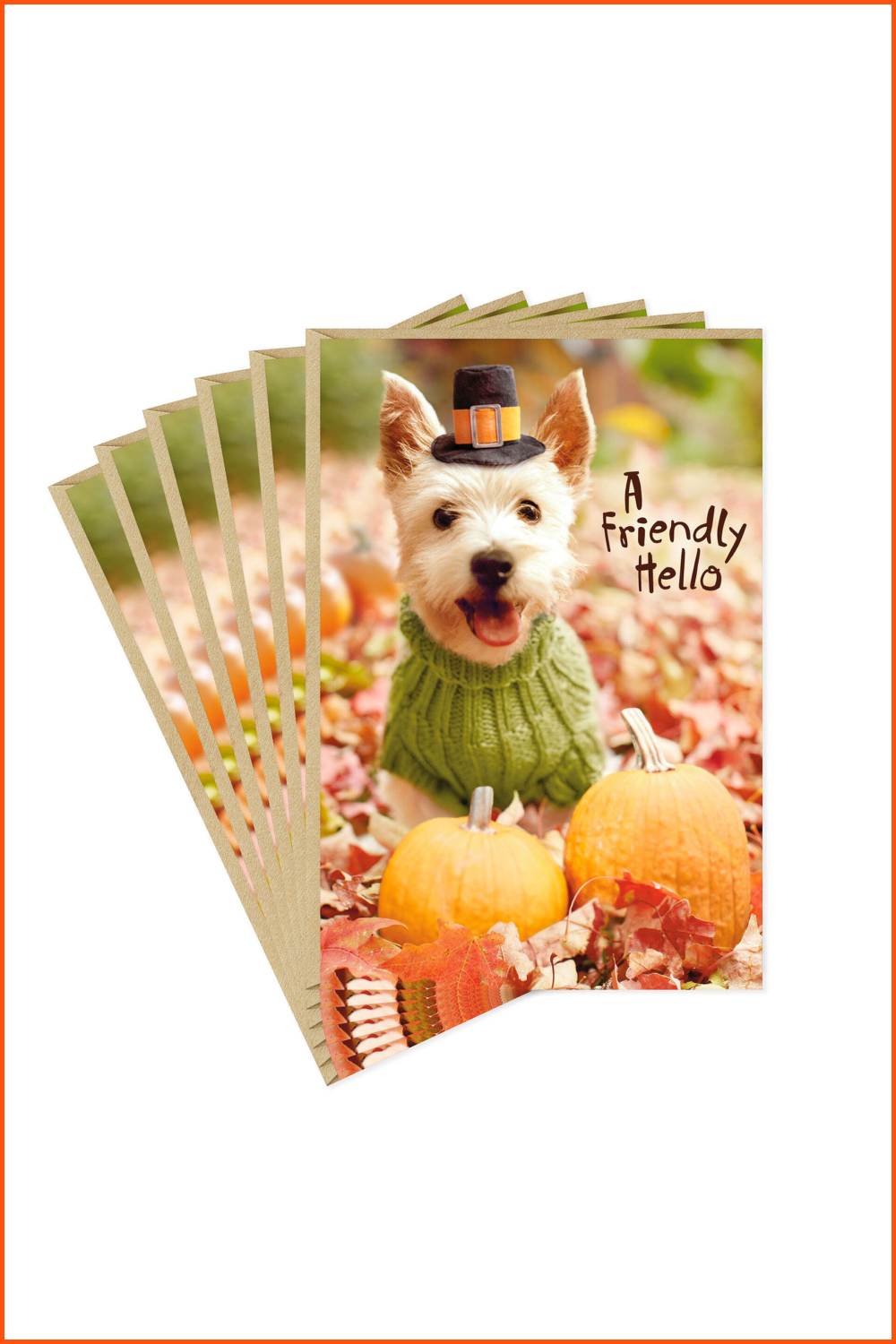 Postcard with a white dog in a green sweater and a top hat next to orange pumpkins.