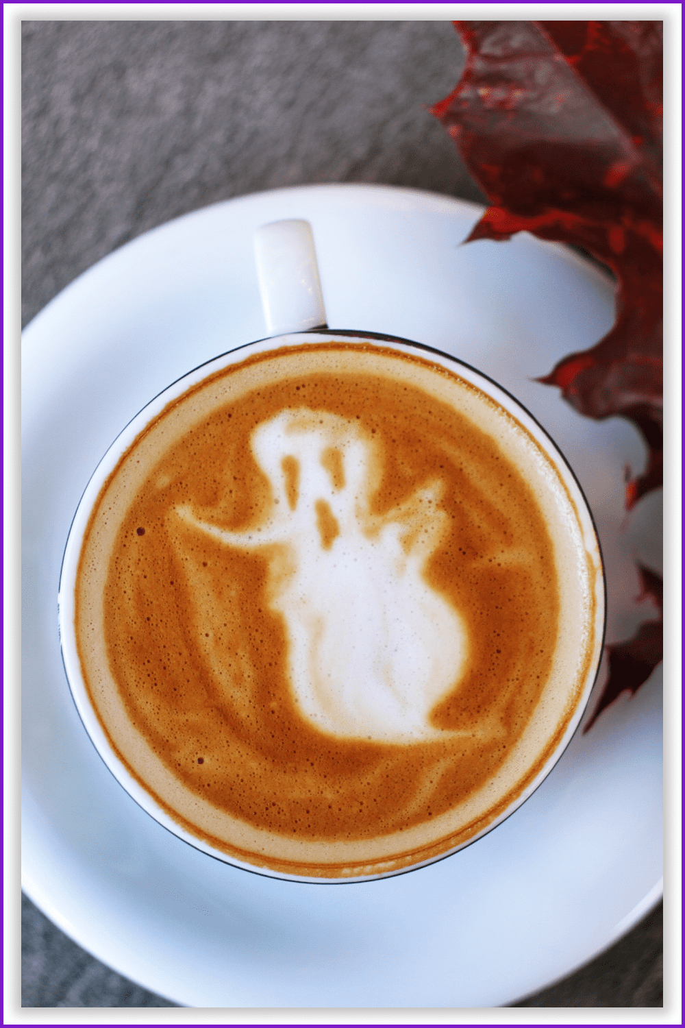 Photo of a cup of coffee with milk with a picture of a ghost.