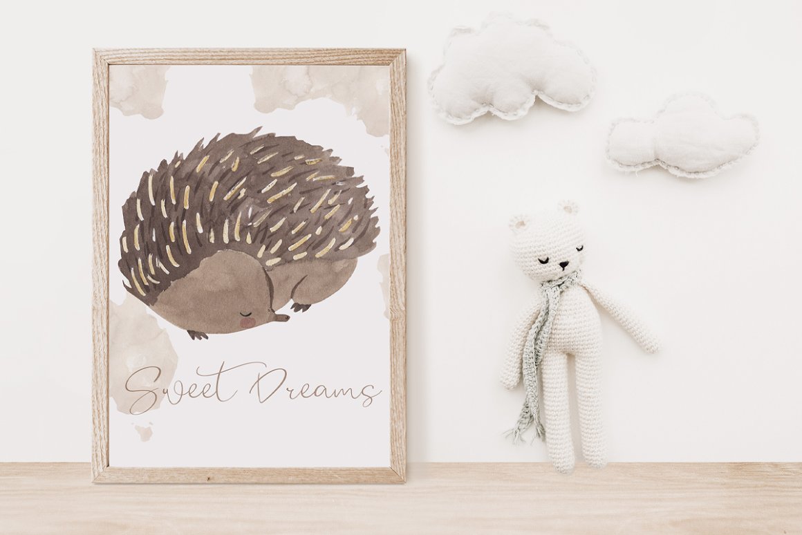 Watercolor picture with a sleeping echidna in a wooden frame with a white bear toy on a white background.