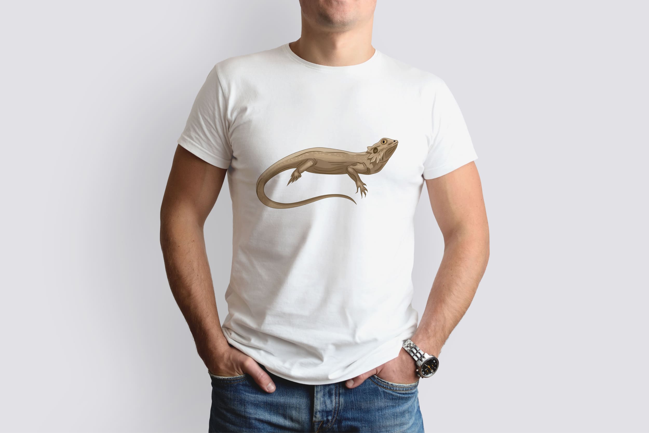 A white t-shirt on a man with an image of a brown bearded dragon, which lies.