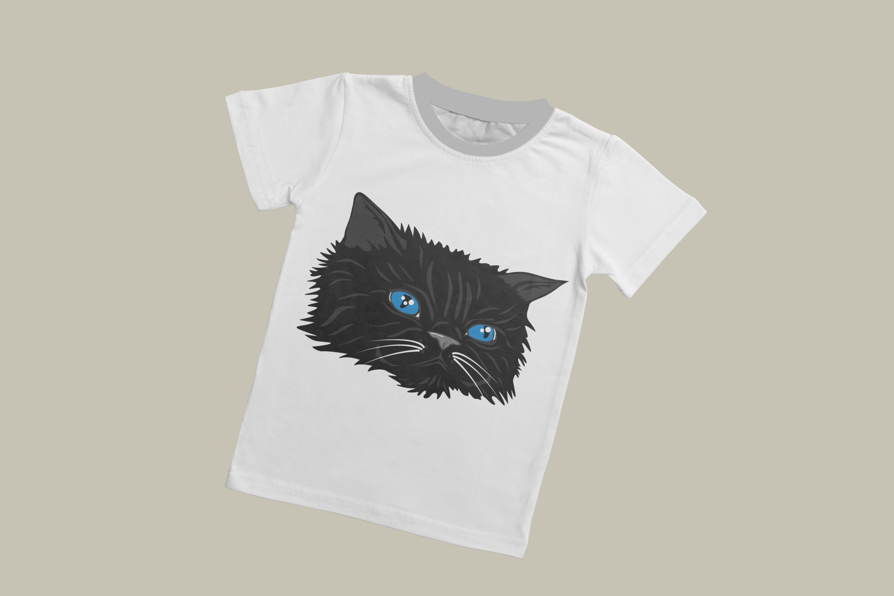 A white T-shirt with a grey collar and the face of a fluffy black cat with blue eyes on a grey background.